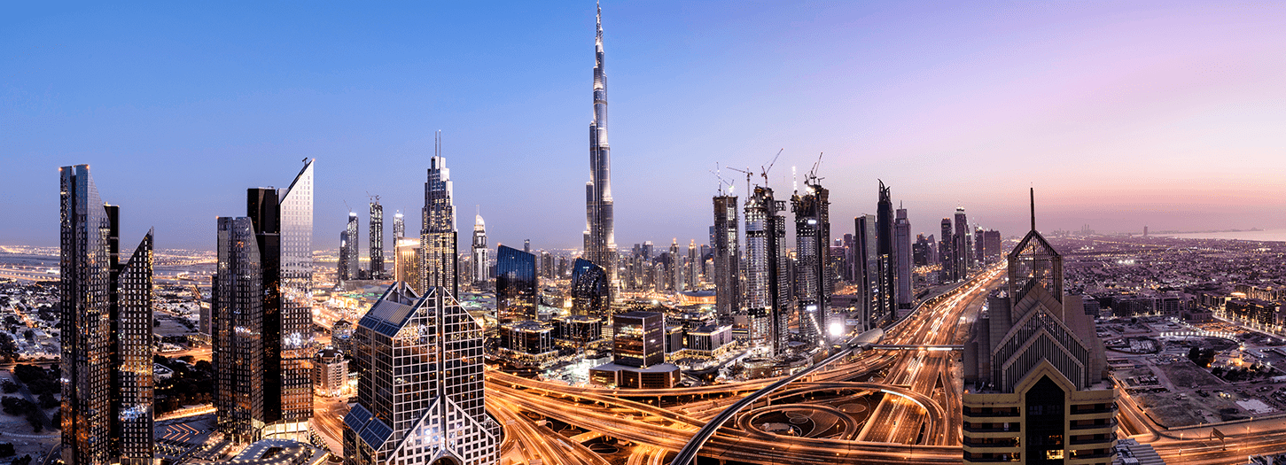 Nightime view of Dubai with the Burj el Arab in the centre
