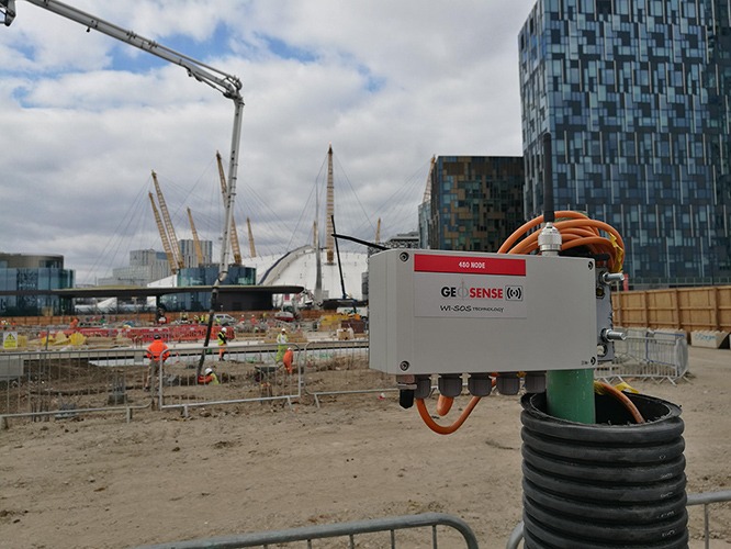 WI-SOS 480 five channel Node mounted on top of borehole with the Millennium dome in the background